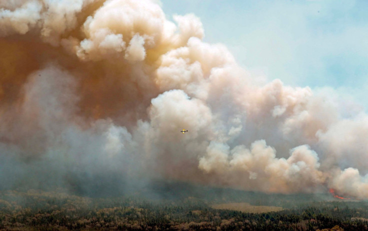 New Brunswick aircraft drops fire retardant in Barrington Lake, Nova Scotia