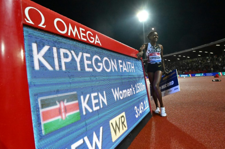 Kenya's Faith Kipyegon poses after winning the women's 1500m in a new world record of 3:49.11