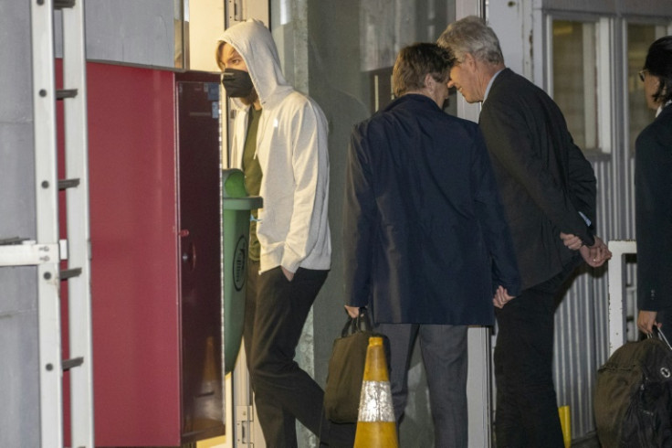 The three freed men at Melsbroek military airport in Belgium