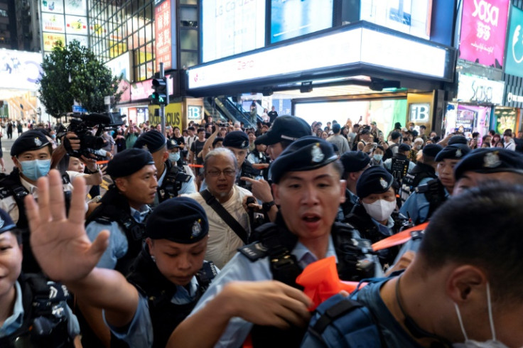 Police detained performance artist Sanmu Chen (C) in Hong Kong on June 3, 2023, the eve of the anniversary of the 1989 Tiananmen Square crackdown