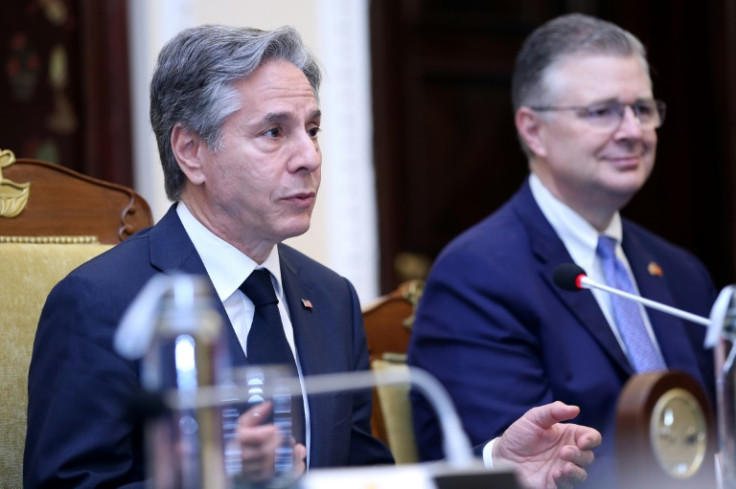 US Secretary of State Antony Blinken (L) and Assistant Secretary of State for East Asian and Pacific Affairs Daniel Kritenbrink (R), speak on a trip to Hanoi