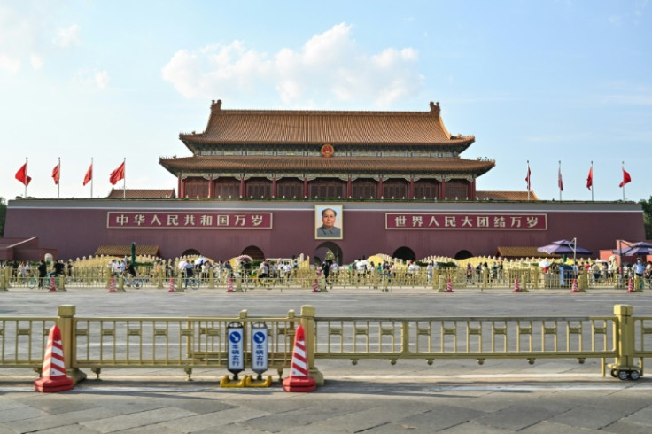 People are seen next to the Tiananmen Gate in Beijing on June 3, 2023, a day before the anniversary of the 1989 Tiananmen crackdown