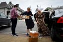 Russian volunteers carry humanitarian aid collected for evacuees