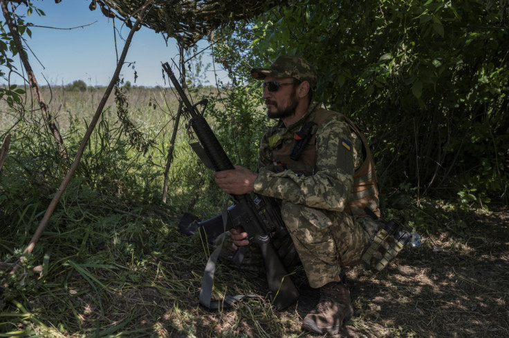 A Ukrainian serviceman looks on near the Ukraine-Russia border in Kharkiv region