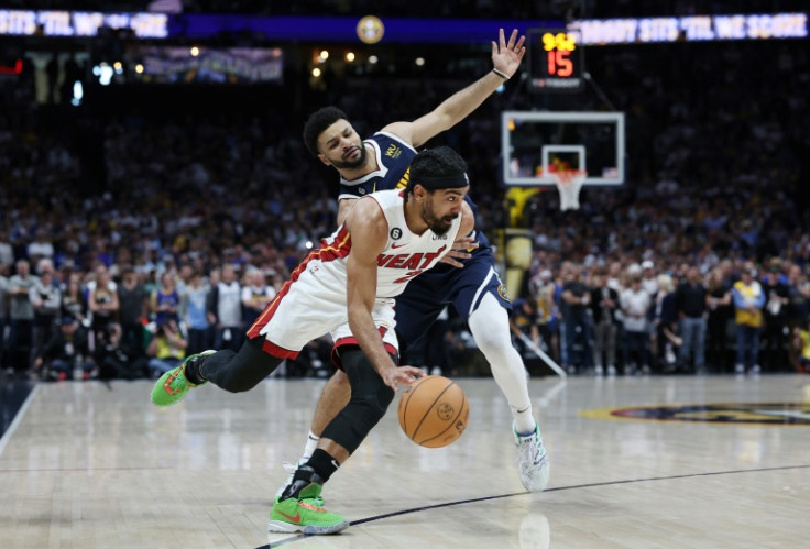 Miami's Gabe Vincent drives past Jamal Murray of the Denver Nuggets in the Heat's victory in game two of the NBA Finals