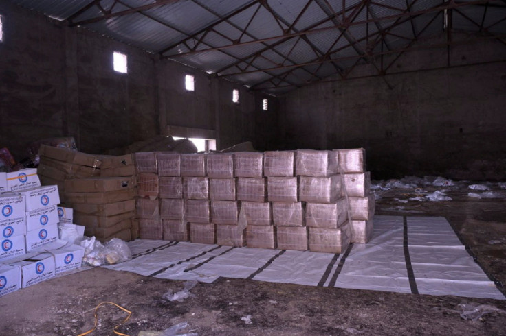 Boxes containing aid are stockpiled in a warehouses run by Sudan Humanitarian Aid Commission in Port Sudan