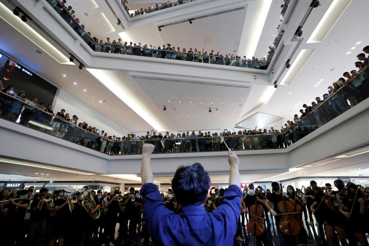 A group of music performers plays a protest song "Glory to Hong Kong" during an anti-extradition bill protest in flash mob inside a shopping mall at Kowloon Tong, in Hong Kong