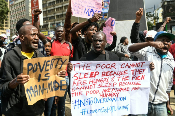 The demonstrators waved placards reading "Will more taxation lead to low cost of living" and "Poverty is man-made"