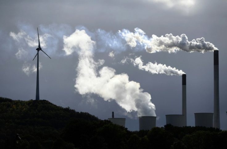 Wind turbine and a coal power plant in Germany