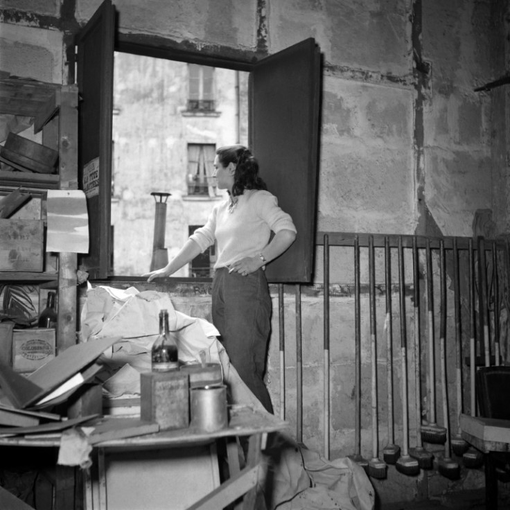 French painter Francoise Gilot poses in a painter's studio in 1953