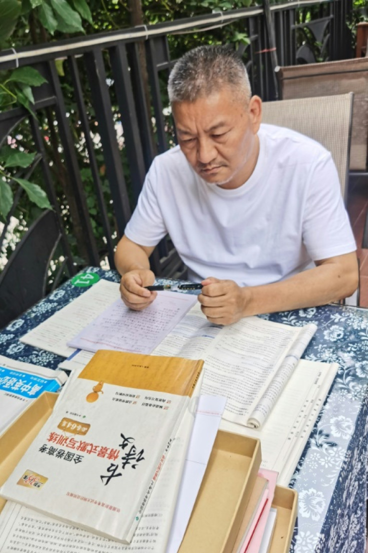Liang Shi has spent the past few months studying textbooks 12 hours a day -- leaving no time for mahjong with friends, he told AFP