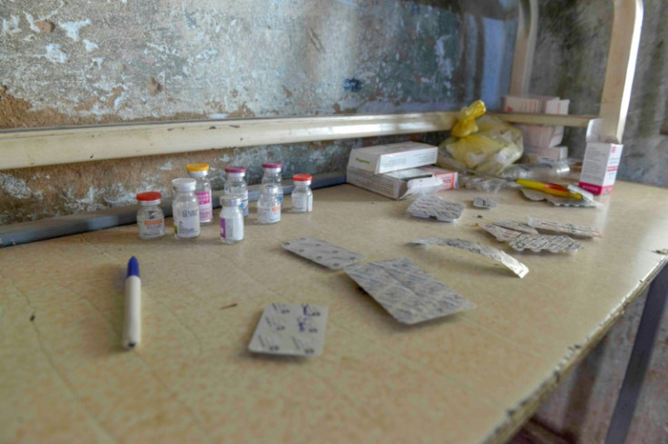 With hospitals ransacked or destroyed, Sudanese volunteers set up a makeshift emergency room in a school building in Omdurman