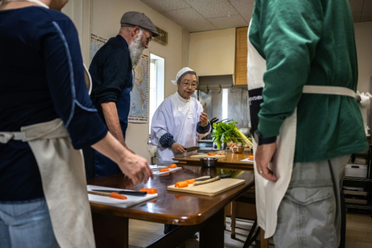 "Shojin ryori" specialist Mari Fujii (C) leads workshops on how to cook traditional Buddhist vegetarian cuisine
