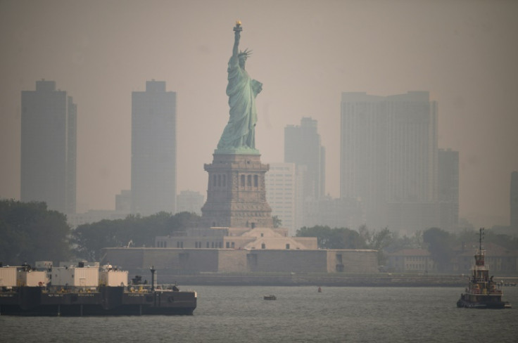 The Statue of Liberty is shrouded in smog caused by wildfires in Canada
