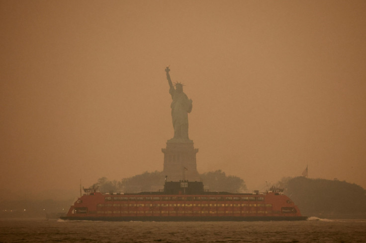 The Statue of Liberty is covered in haze and smoke caused by wildfires in Canada, in New York