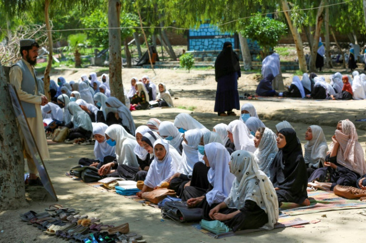Afghan primary school grils attend an open air class in Jalalabad in May 2023