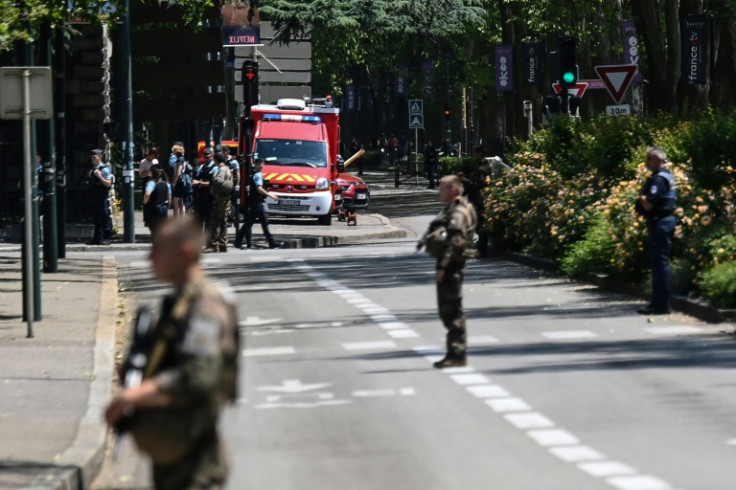 Troops and ambulances near the scene of the stabbing attack in Annecy, France