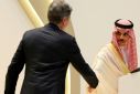 US Secretary of State Antony Blinken  approaches to shake the hand of Saudi Foreign Minister Faisal bin Farhan during a joint press conference in Riyadh