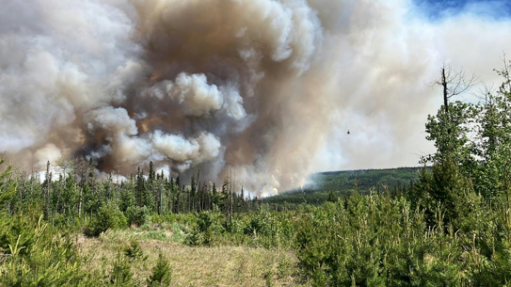 This handout image provided by the BC Wildfire Service on June 7 shows smoke from the West Kiskatinaw River and Peavine Creek wildfires in the Dawson Creek Zone, British Colombia, Canada
