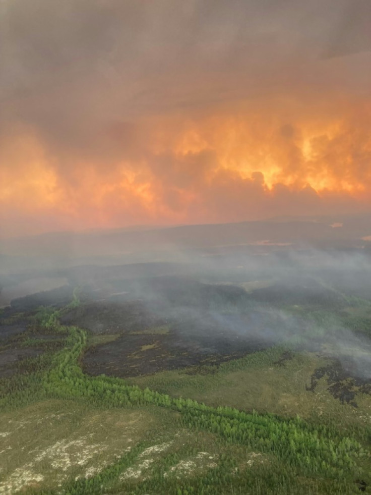 This handout image courtesy of helicopter pilot Kevin Burton shows an aerial view of wildfires between Chibougamau and the Mistissini Indigenous community in northern Quebec on June 5, 2023