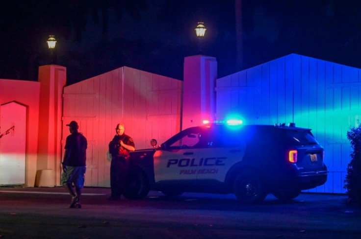 Police are pictured during an FBI raid on US President Donald Trump's residence in Palm Beach, Florida on August 8, 2022