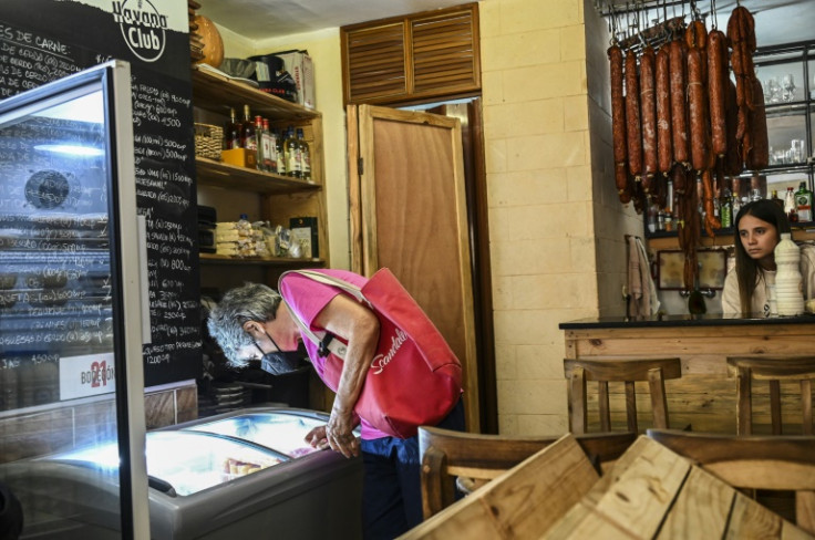 In a private store, a kilogram of milk powder sells forabout 2,000 pesos (some $16) -- just less than half the average monthly salary