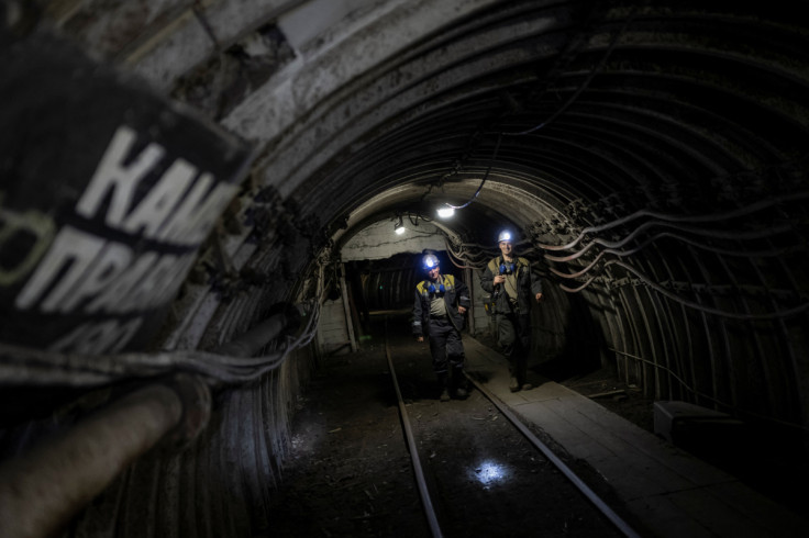 Miners walk inside a coal mine in Dnipropetrovsk region
