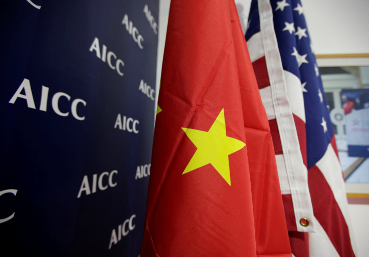 Flags of U.S. and China are displayed at AICC's booth during China International Fair for Trade in Services in Beijing