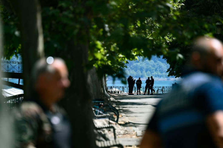Police near the scene of the stabbing in Annecy, France