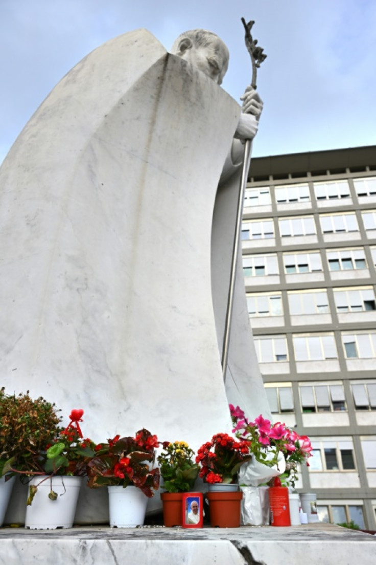 Well-wishers have laid candles and flowers at the entrance of the Rome's Gemelli hospital