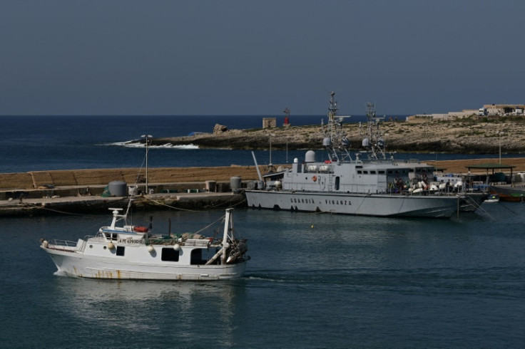 A view shows a patrol vessel (R) of Italian law enforcement agency Guardia di Finanza in the harbour of the island of Lampedusa