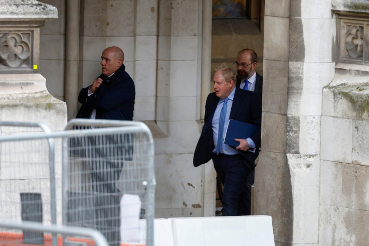 Former British PM Johnson walks at the parliament in London
