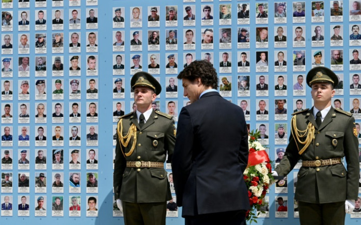 Canadian Prime Minister Justin Trudeau lays flowers at the Wall of Remembrance to pay tribute to killed Ukrainian soldiers in Kyiv