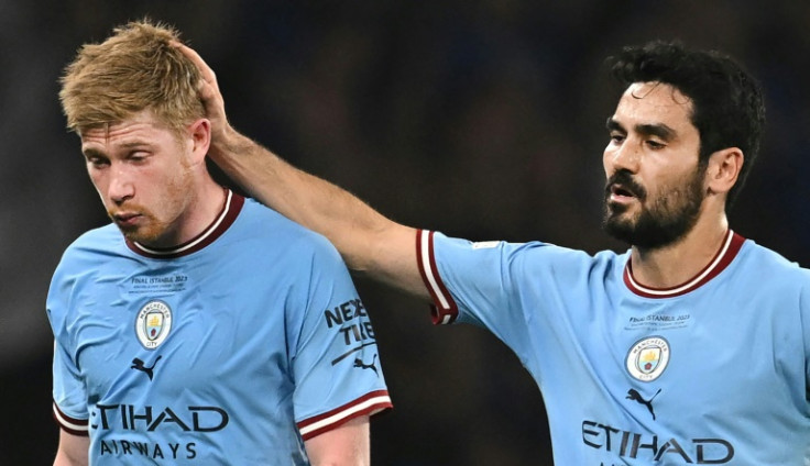 Kevin De Bruyne is consoled by Ilkay Gundogan as Manchester City's Belgian playmaker comes off injured in the first half