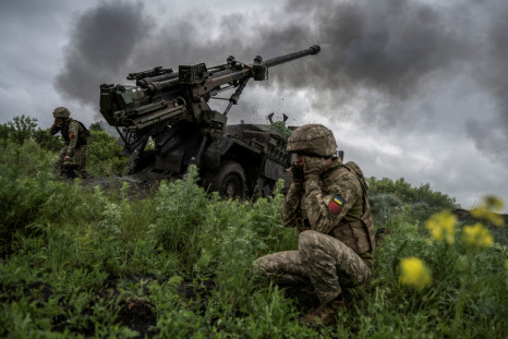 Ukrainian service members fire a Caesar self-propelled howitzer towards Russian troops near Avdiivka