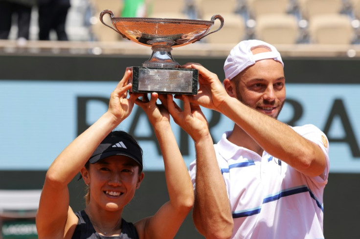 Default was 'unjust': Japan's Miyu Kato (left) and Germany's Tim Puetz after winning the mixed doubles title