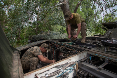 Ukrainian servicemen repairs a BMP-1 infantry fighting vehicle in Donetsk region