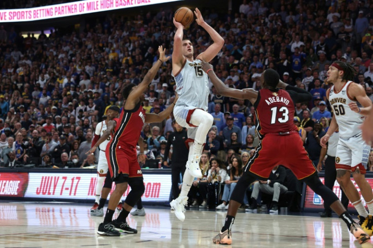 Nikola Jokic drives to the basket as Denver clinch their first NBA championship in history