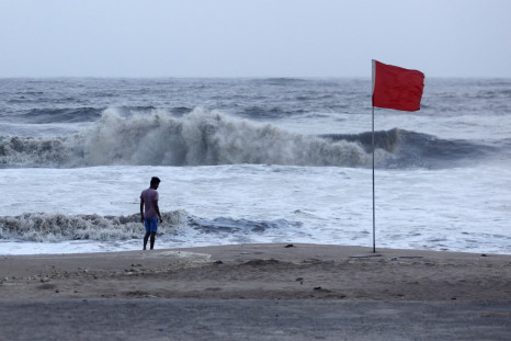 A lifeguard patrols Juhu beach during a red flag alert due to rough seas caused by cyclone Biparjoy, in Mumbai