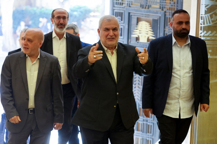 The head of Hezbollah's parliamentary bloc, Mohammad Raad, gestures upon arrival to attend a parliament session in Beirut