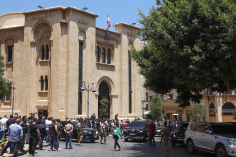 Journalists gather as members of parliament leave after they failed to elect a head of state to fill the vacant presidency, in downtown Beirut