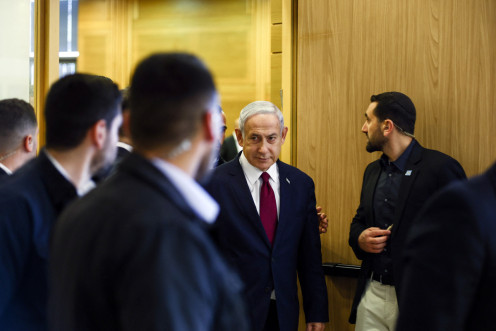 Israeli Prime Minister Benjamin Netanyahu leaves his Likud party faction meeting at the Knesset, Israel's parliament, in Jerusalem