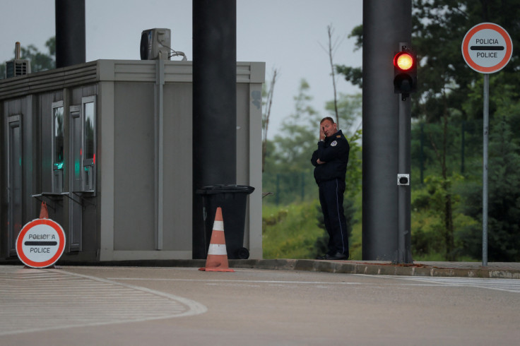 A Kosovo police officer stands at the Kosovo-Serbia border crossing in Merdare