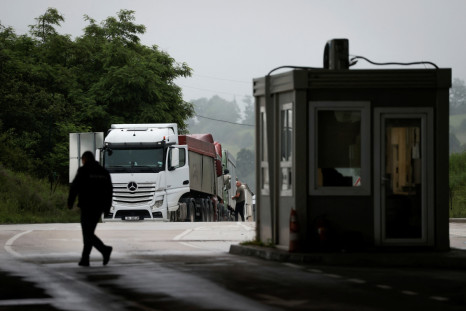 Trucks with goods queue at the Kosovo-Serbia border crossing in Merdare