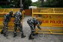 Police install barricades outside the residence of the Wrestling Federation of India's president in New Delhi