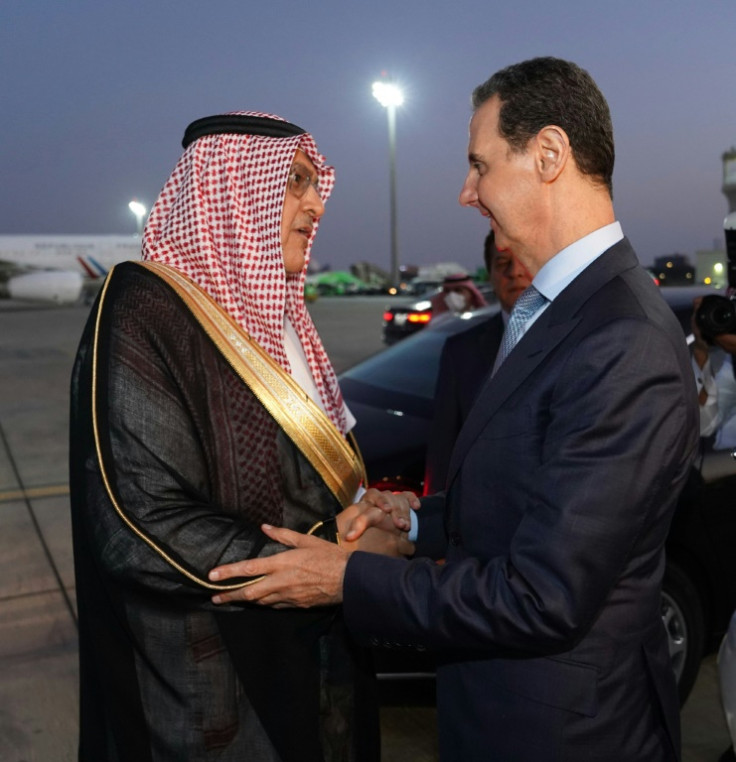 Assad (R) has become less of an international pariah by being welcomed back into the Arab League