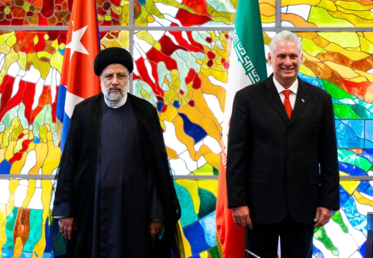 Cuban President Miguel Diaz-Canel (R) and Iran's President Ebrahim Raisi appear together in Havana on June 15, 2023