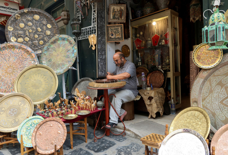A craftsman works outside his shop in the Old City of Tunis