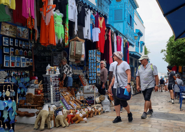 Tourists walk past souvenir shops in Sidi Bou Said