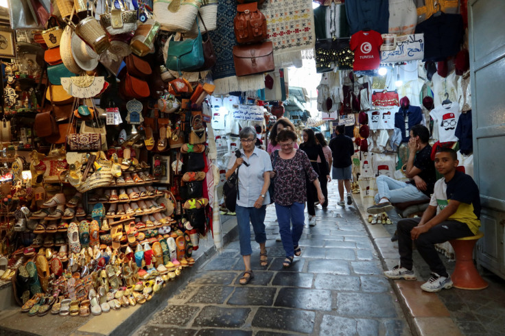 People walk in the tourist bazaar in the Old City of Tunis